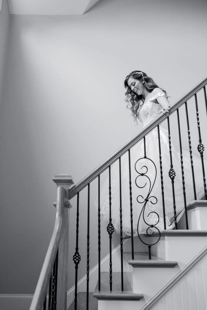 wedding bride making her way down staircase