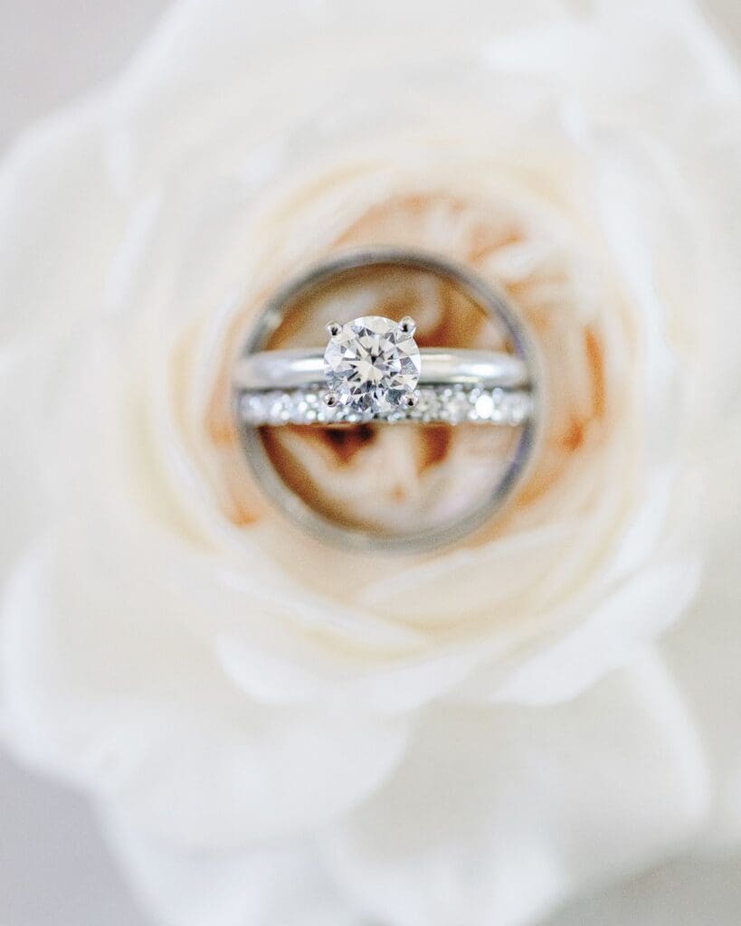 Close up image of wedding rings in a flower