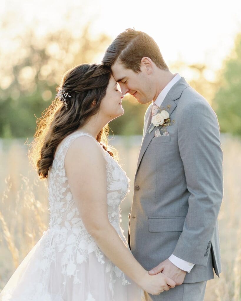 Bride and Groom having a quiet moment together in the glowing sun during sunset