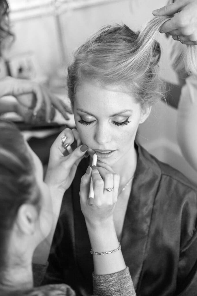 Bride getting her hair and makeup down on her wedding day